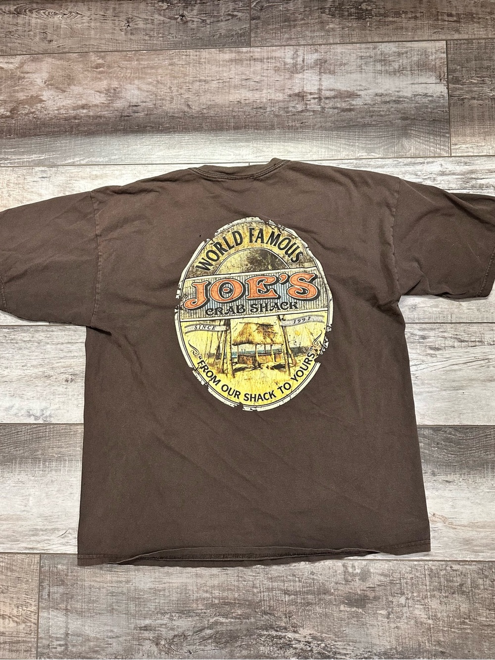 Joe's Crab Shack Brown Short Sleeve Tee with Yellow and Orange Oval Graphic